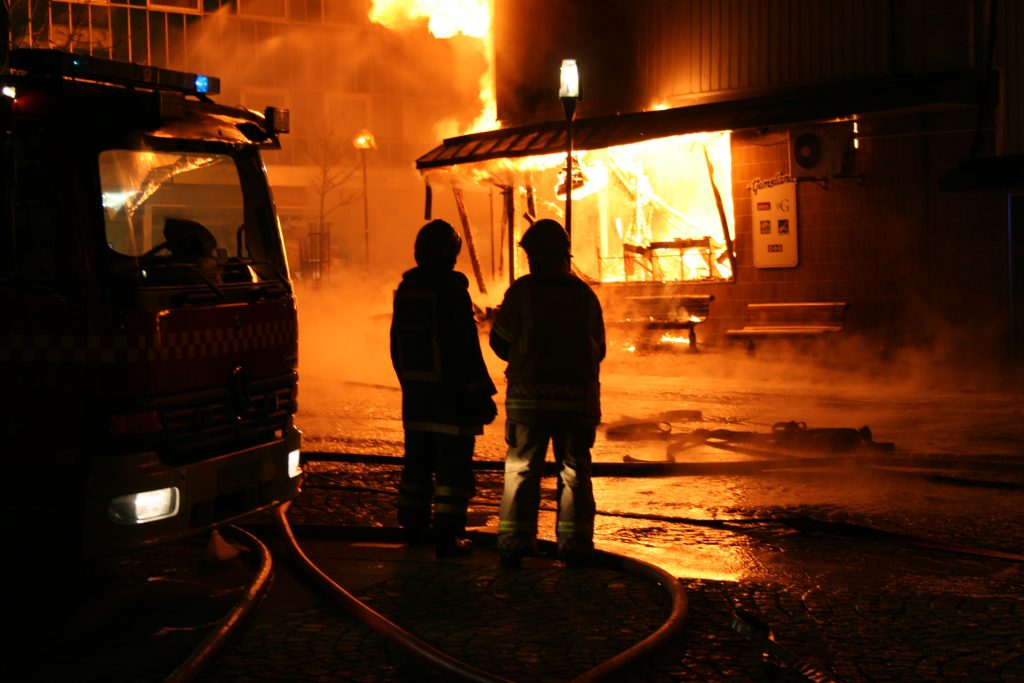 Firemen attending to a fire.
